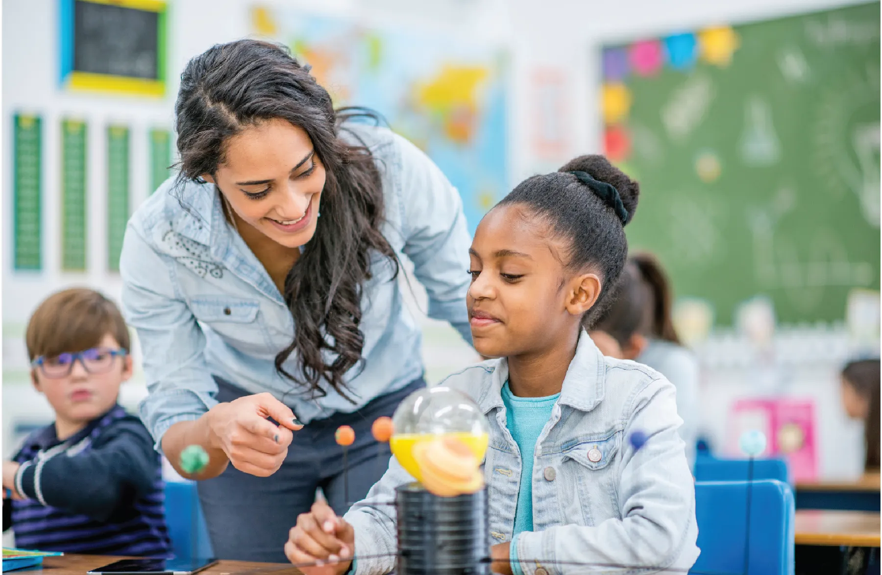 Teacher helping student with science