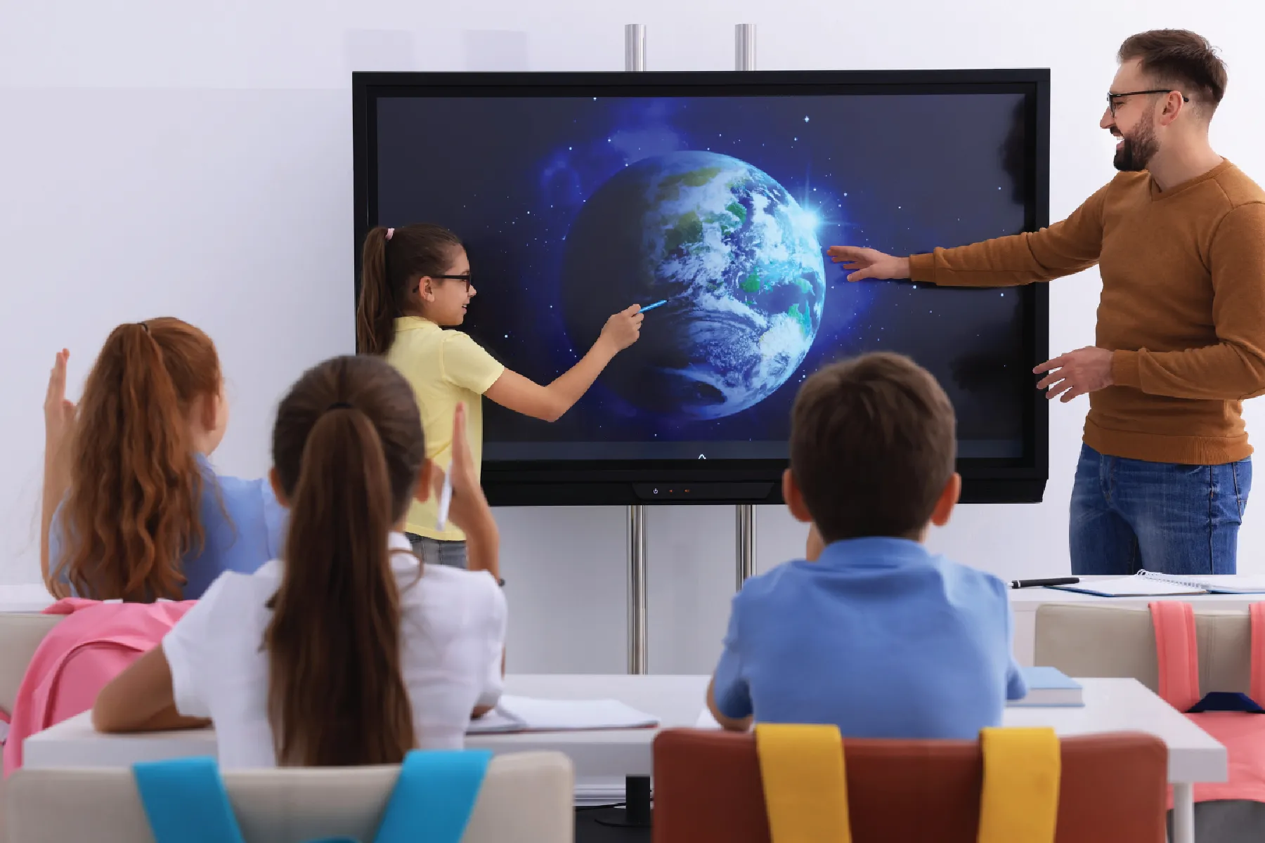 Teacher helping students